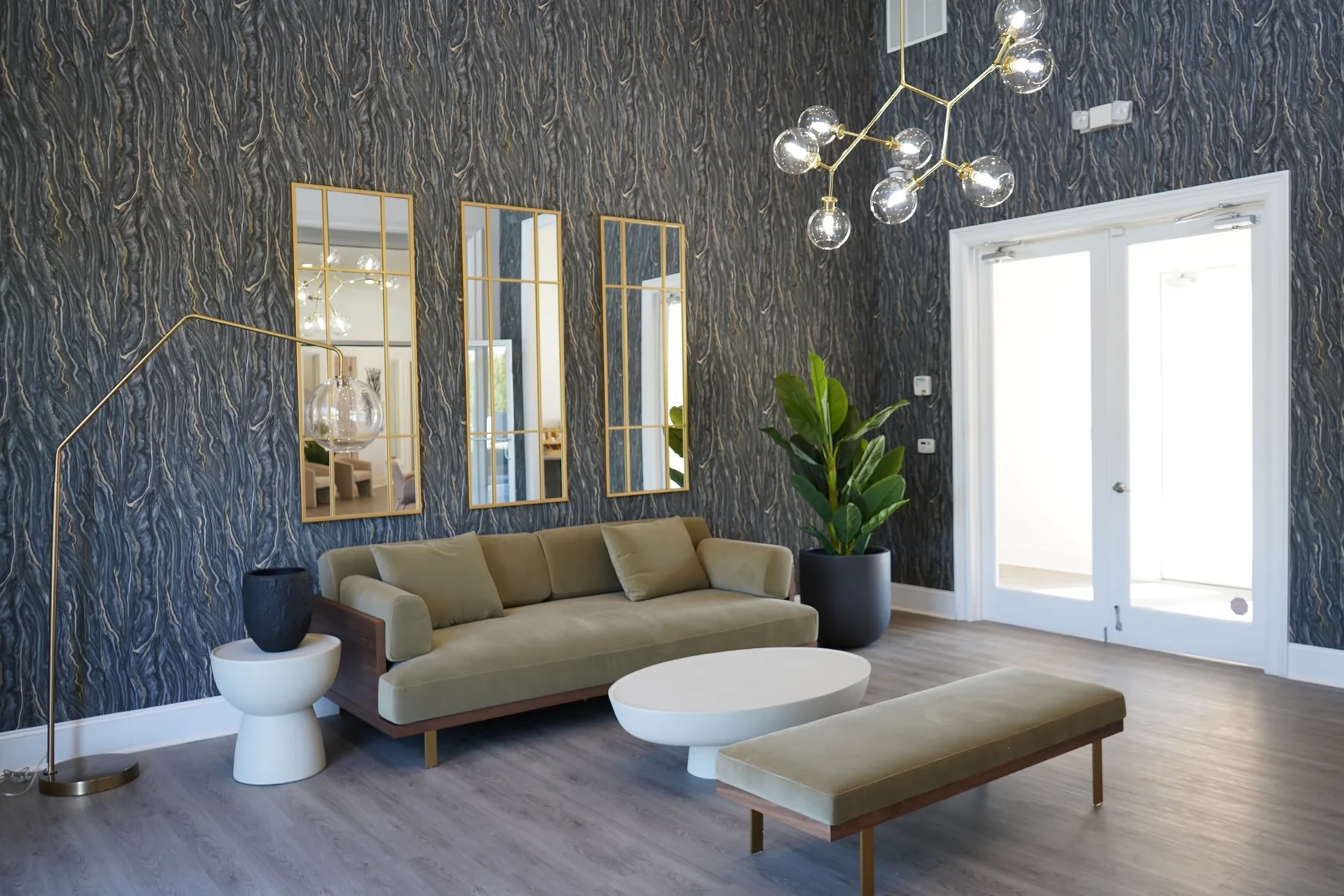 Navy damask wallpaper in a salon interior